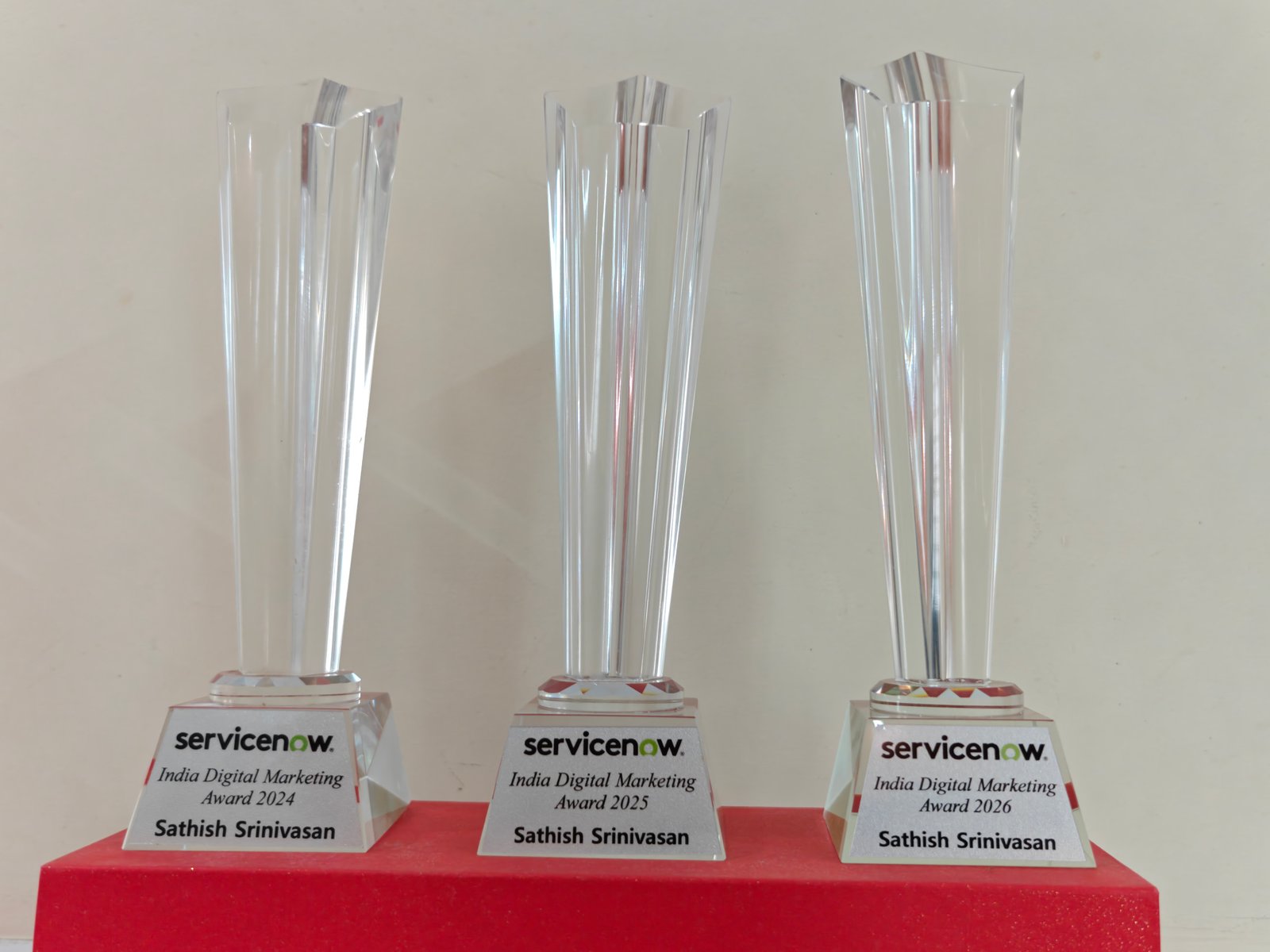 ServiceNow India Digital Marketing Award trophies, 2024, 2025, and 2026